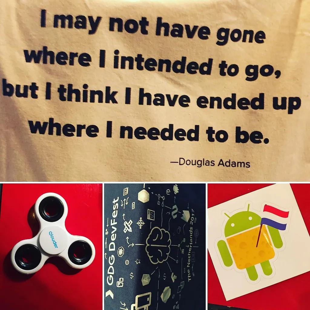 Douglas Adams quote “I may not have gone where I intended to go, but I think I have ended up where I needed to be” above DevFest swag: a fidget spinner, a notebook and an Android sticker